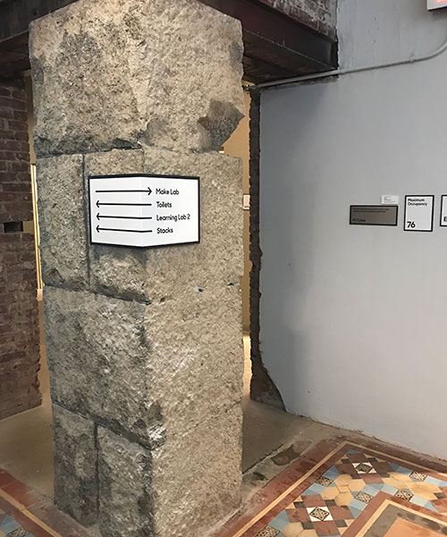 MuseumLab's interior signage wrapping around column