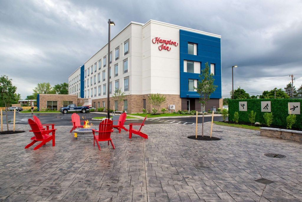 Hampton Inn Exterior with chairs in the foreground