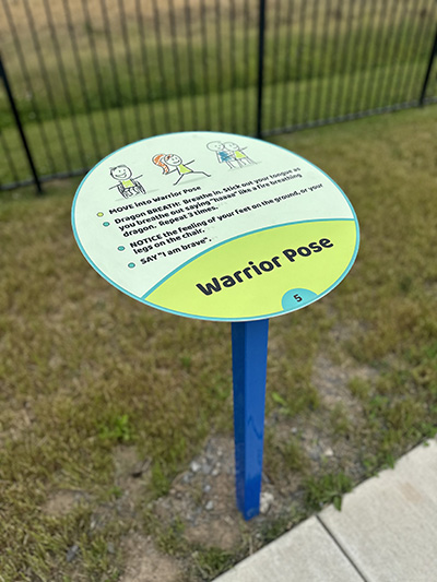 mindfulness trail warrior pose sign